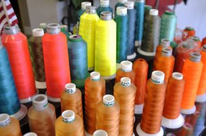 colorful thread on industrial spools